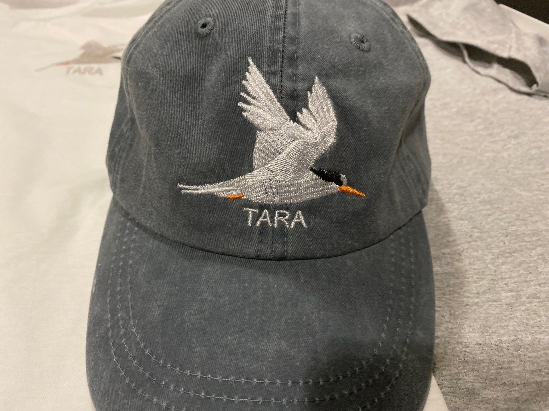 A baseball cap with tara embroidered on it