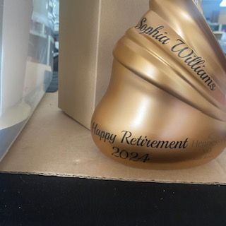 A gold christmas ornament with the name sophia williams on it