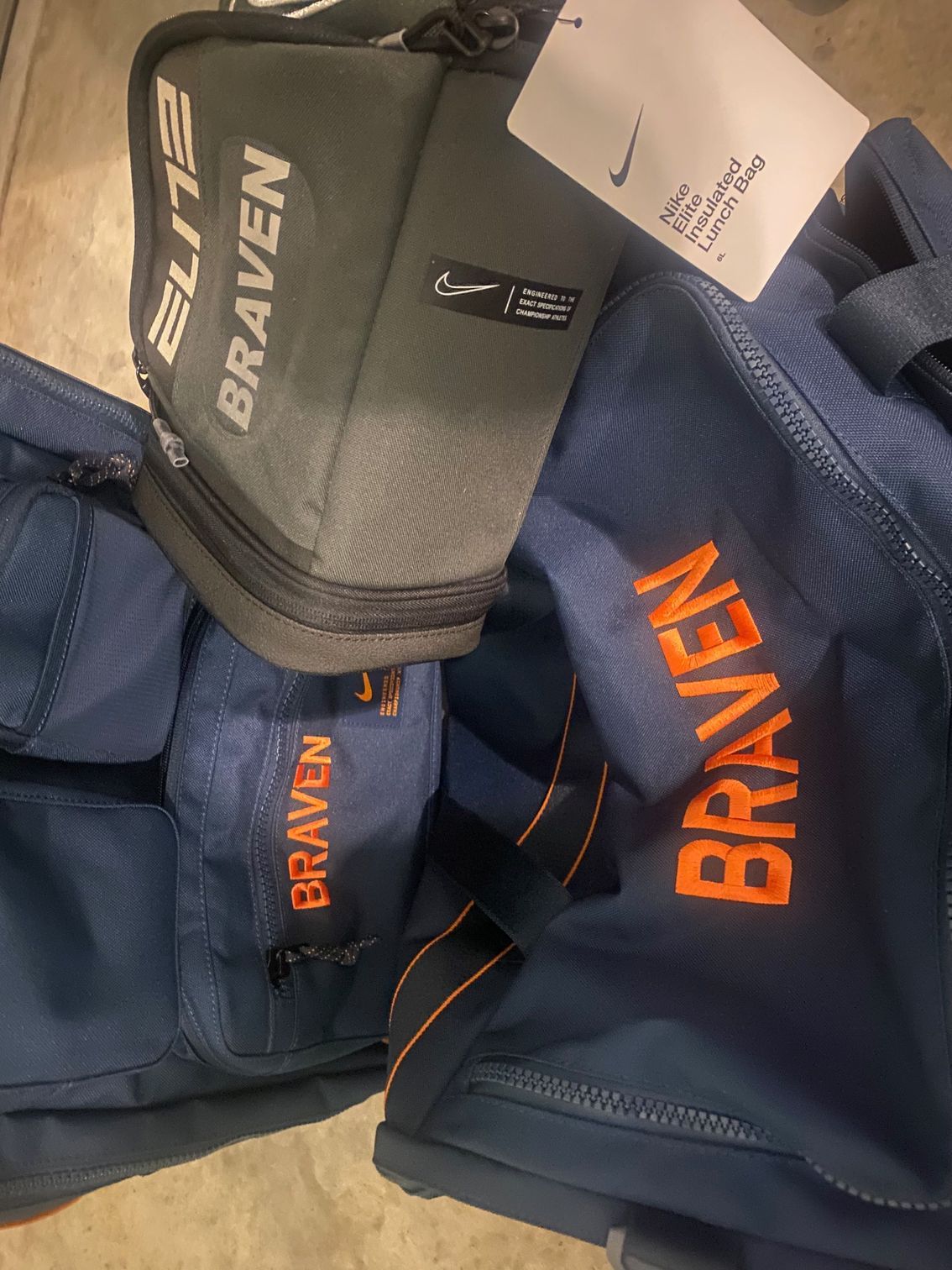 A stack of bags with the word braven embroidered on them.