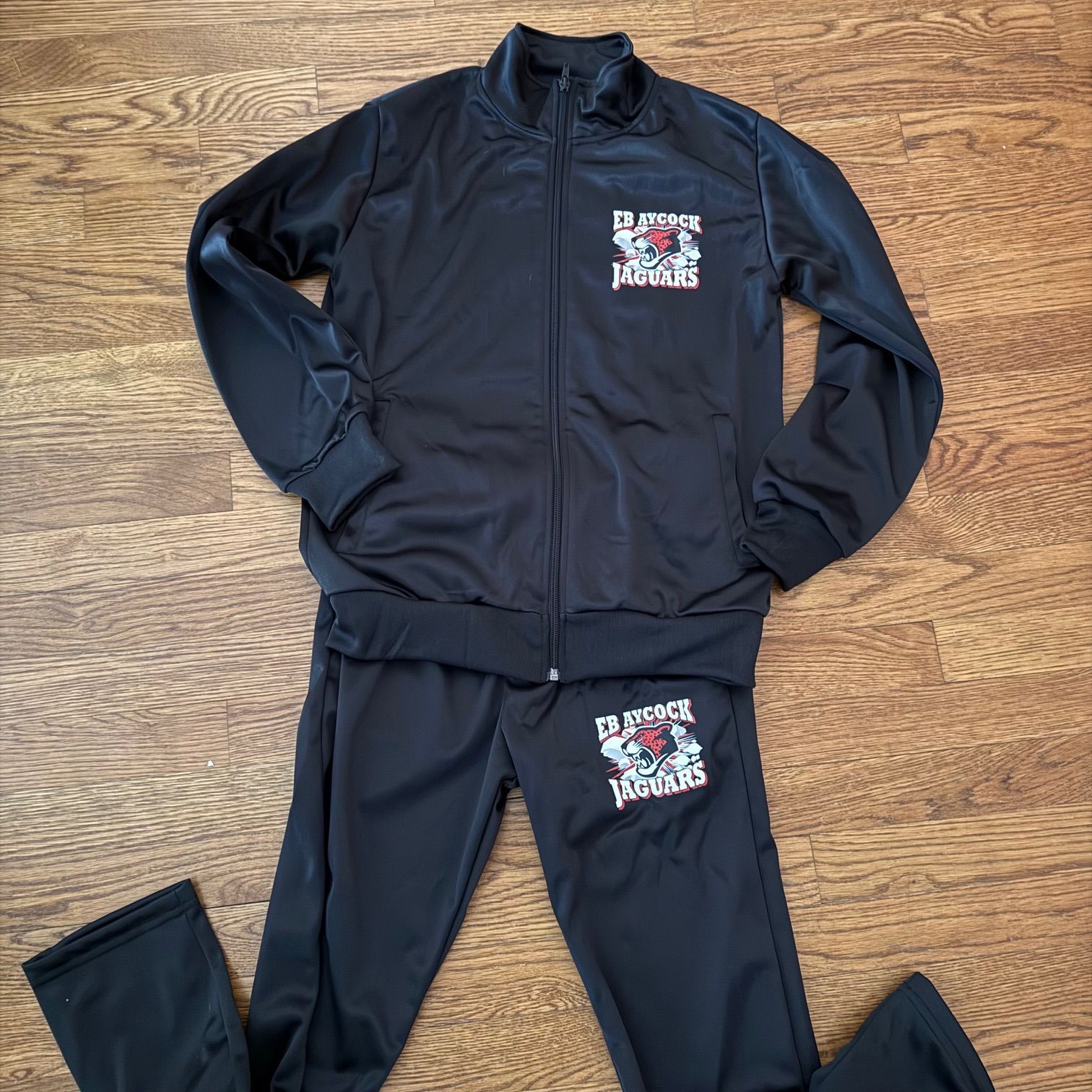 A black jacket with the word raptors on it
