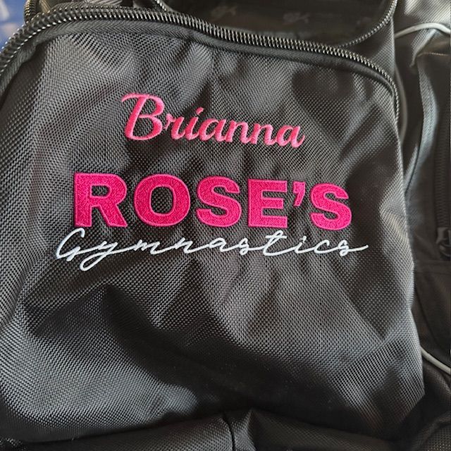 A black duffel bag with the name brianna rose 's gymnastics embroidered on it