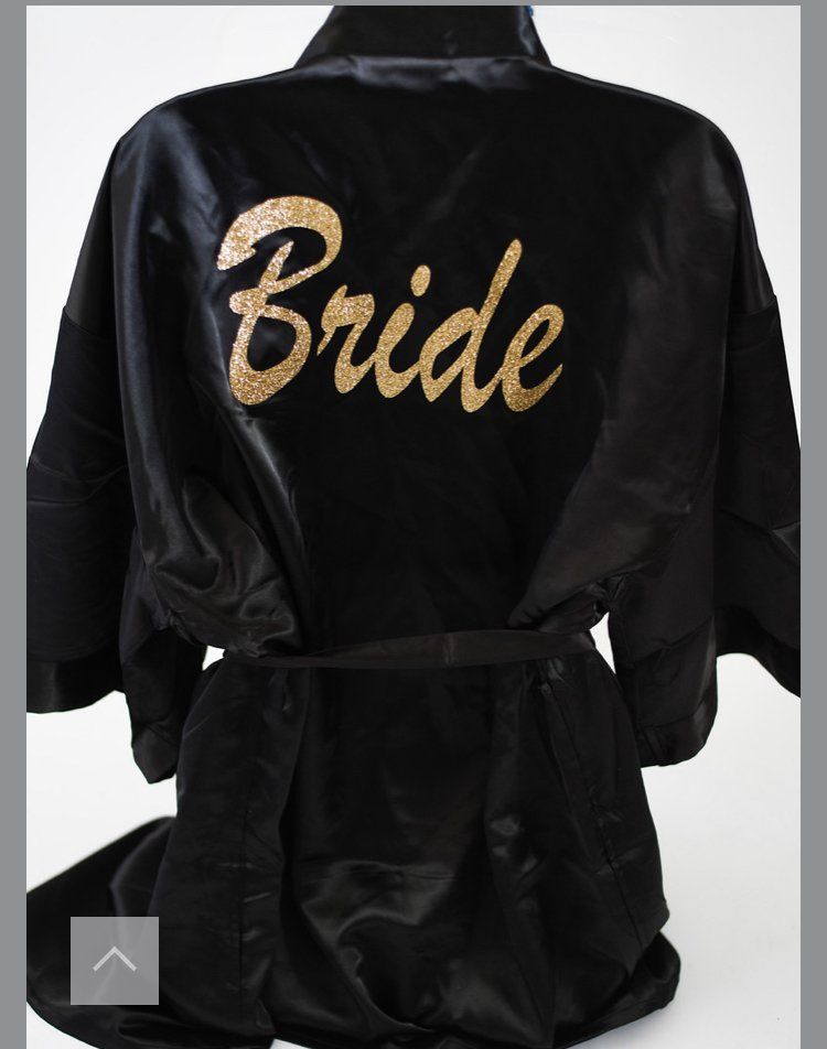 A black robe with the word bride on it
