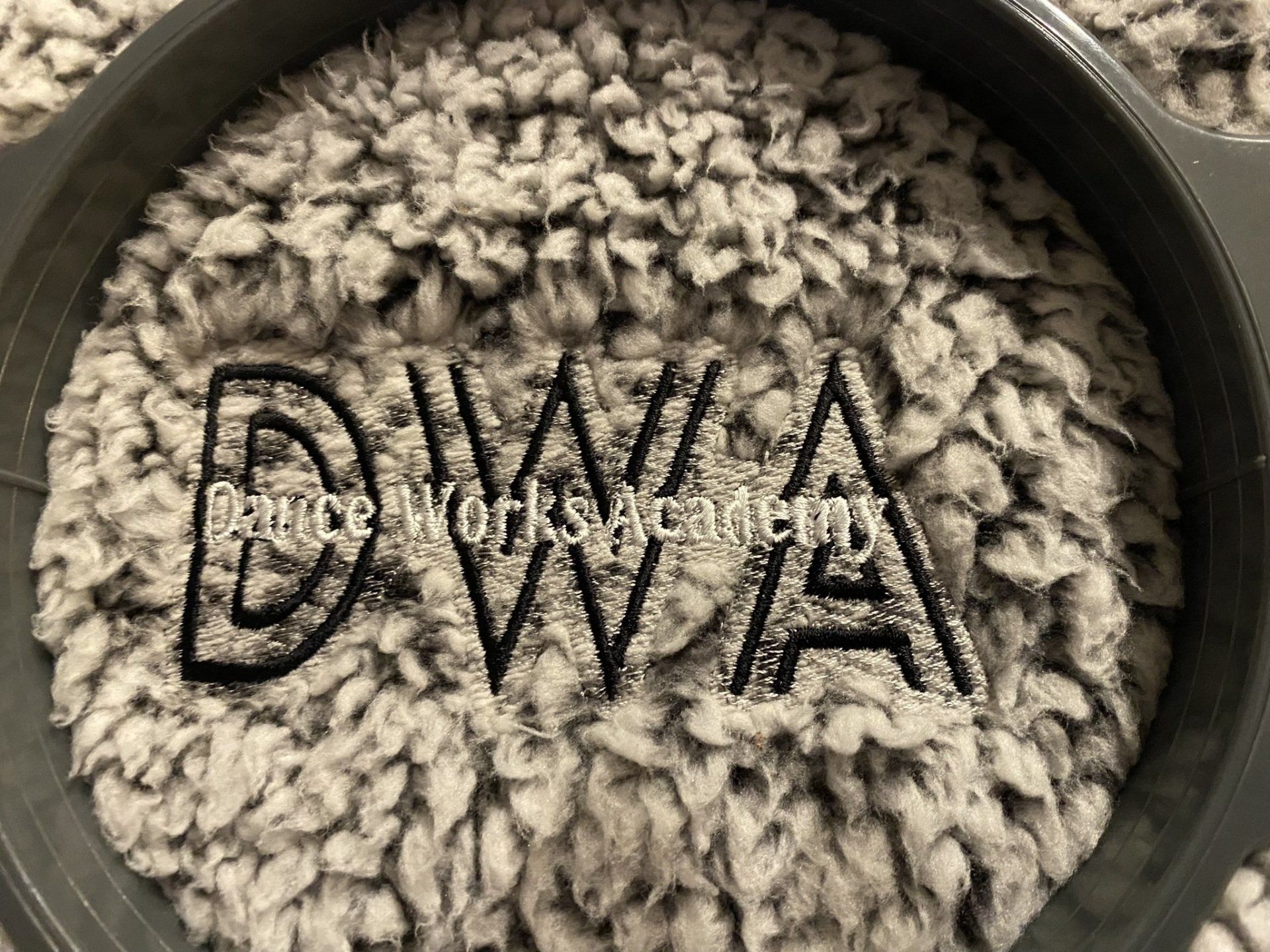 A close up of a carpet with the word dwa written on it