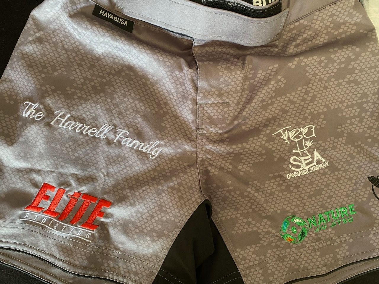 A pair of shorts with the name harrell family embroidered on them