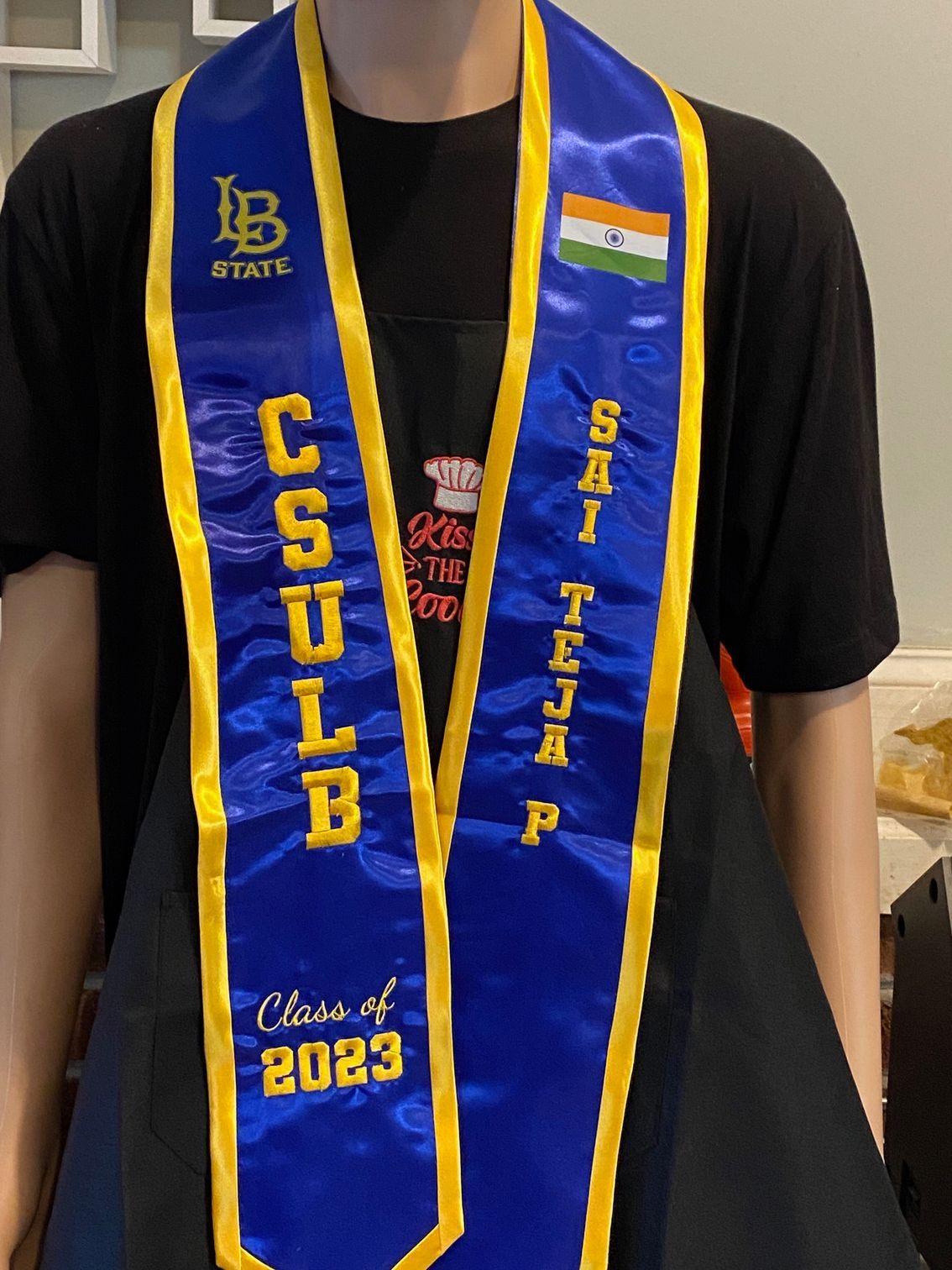 A person wearing a blue sash that says class of 2023