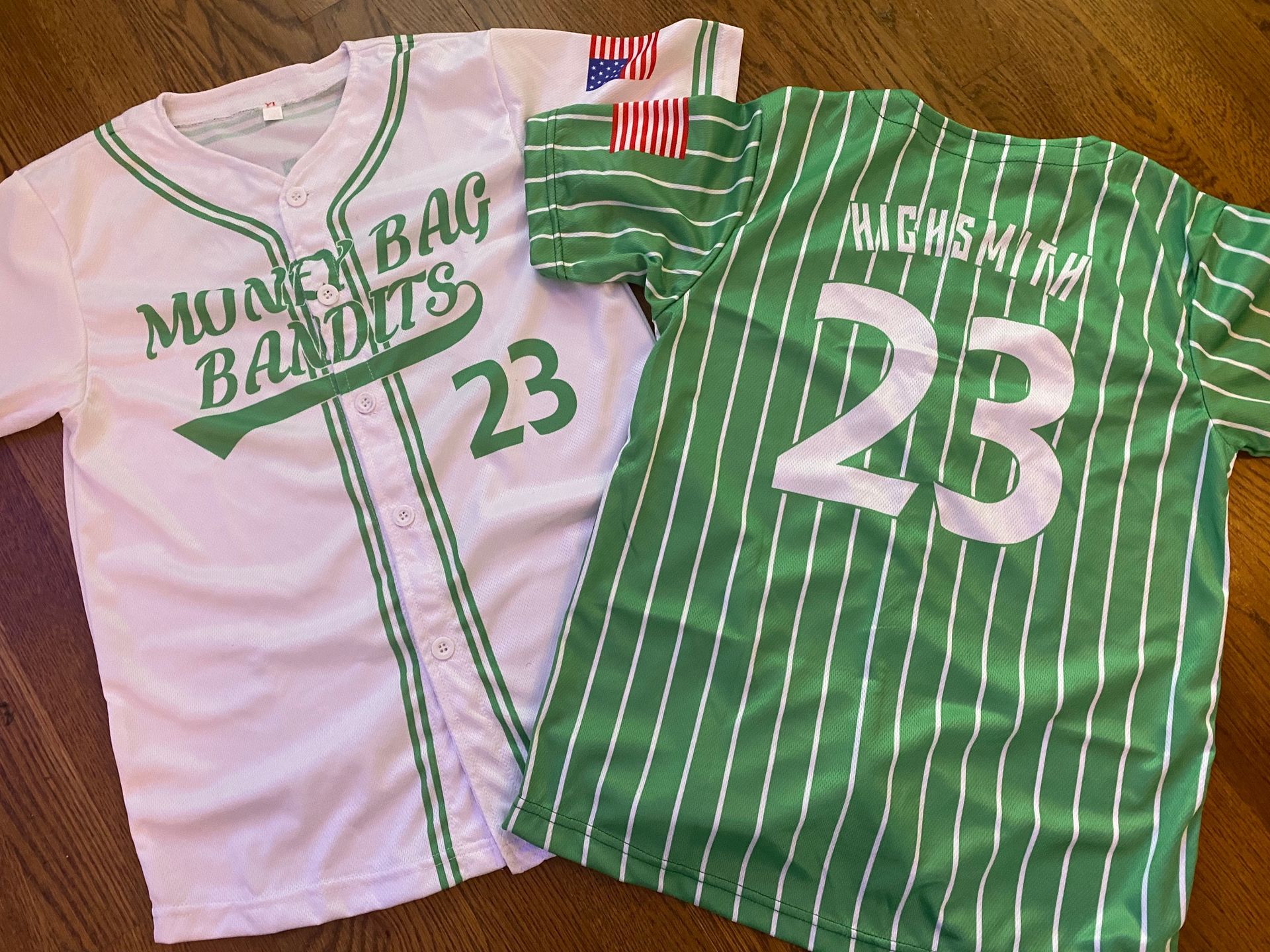 Two baseball jerseys with the number 23 on them