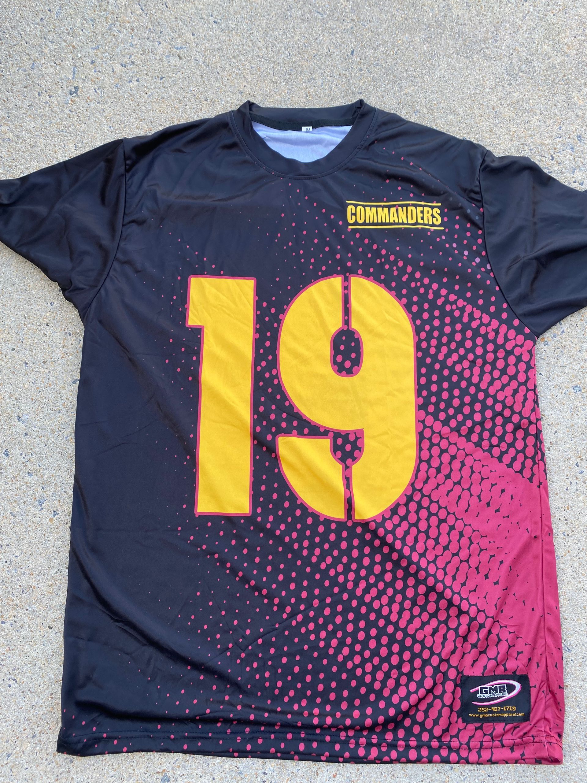 A black jersey with the number 19 on it