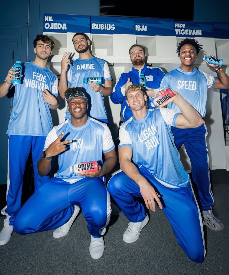 A group of men wearing blue shirts that say speed