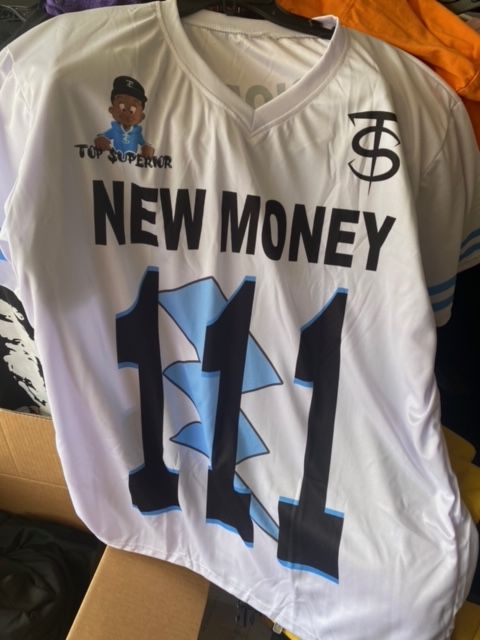 A white jersey with the number 111 on it