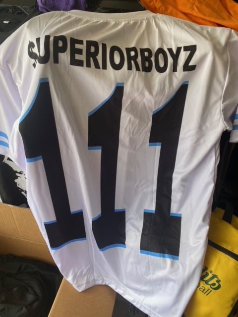 A white jersey with the number 111 on it