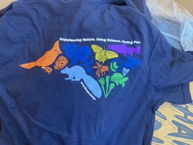 A t-shirt that says experiencing nature going science finding fish