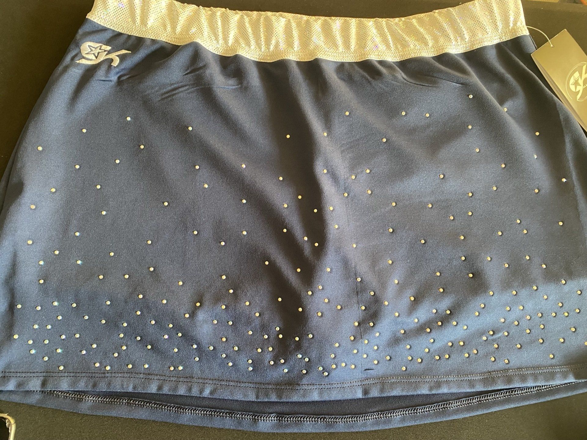 A blue skirt with gold studs on it