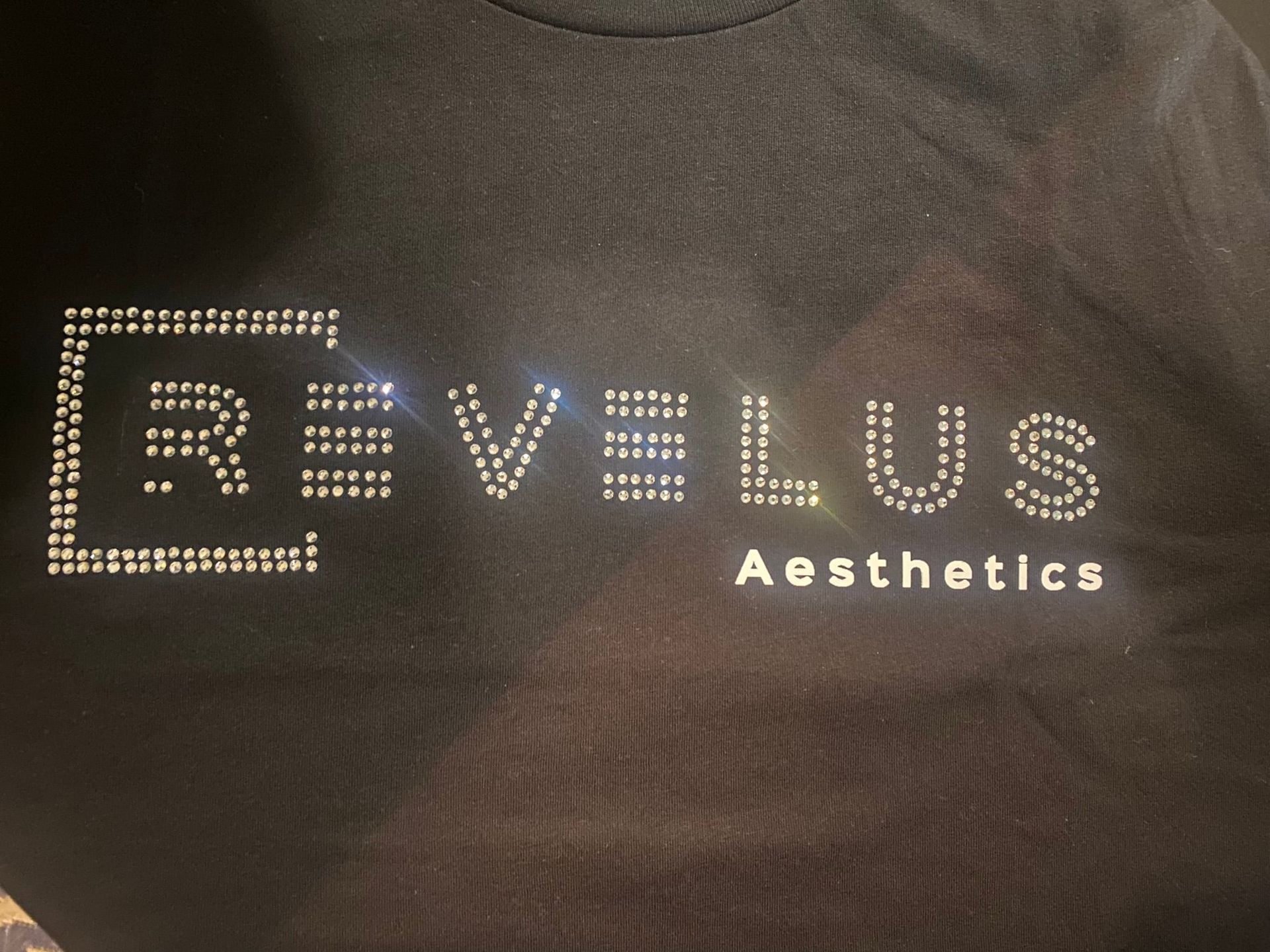 A black shirt that says revelus aesthetics on it