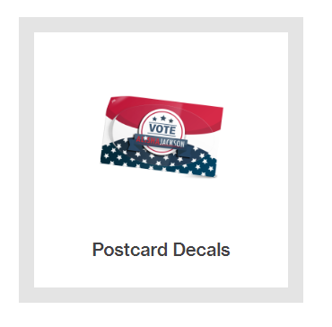 A picture of a postcard with a vote decal on it.