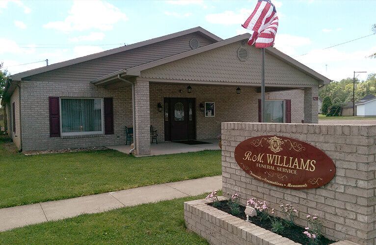 A house with a sign that says ' n.k. williams ' on it