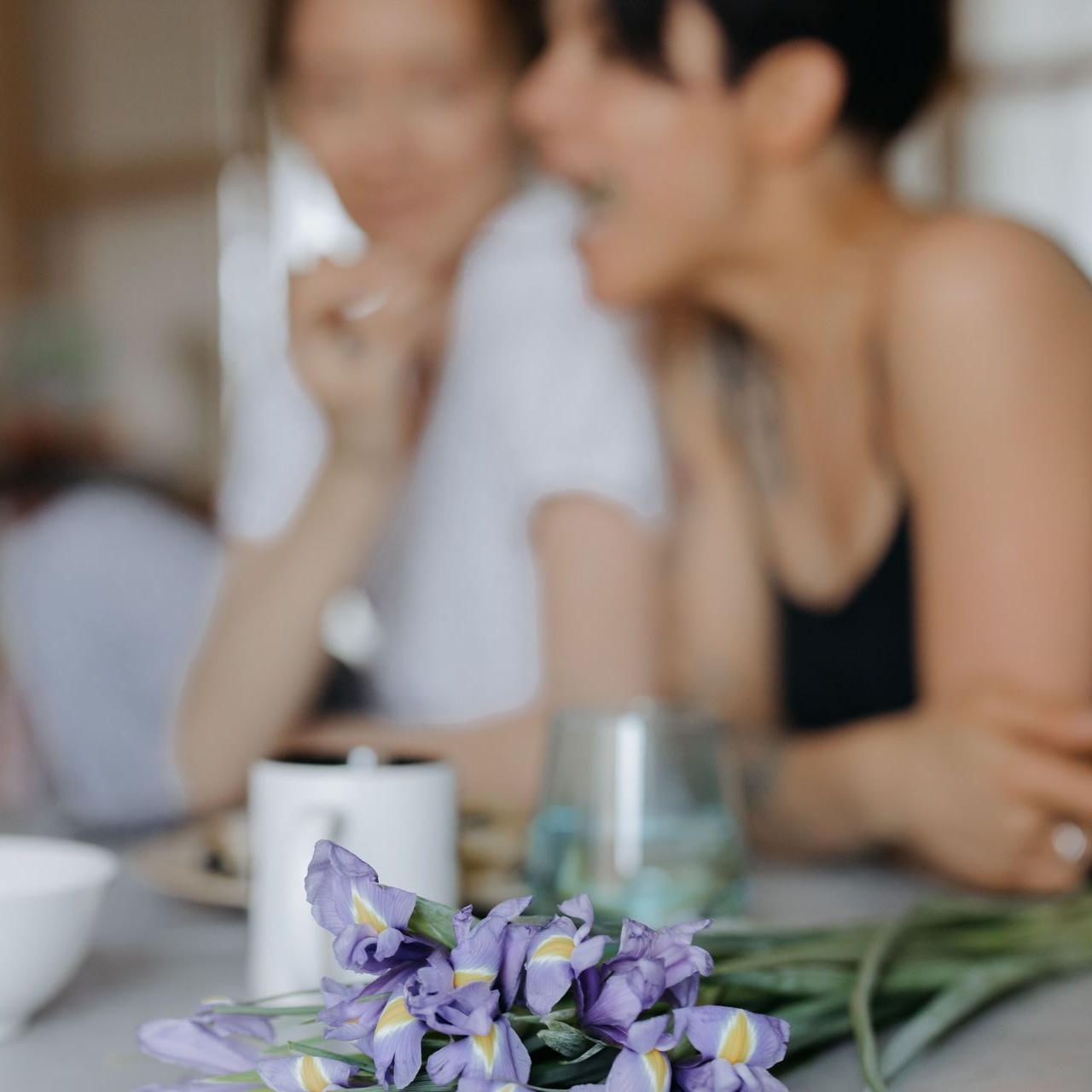 image of two ladies and flowers