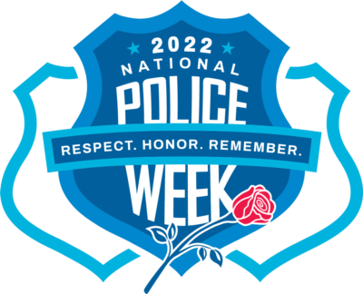 A blue shield with the words national police week on it