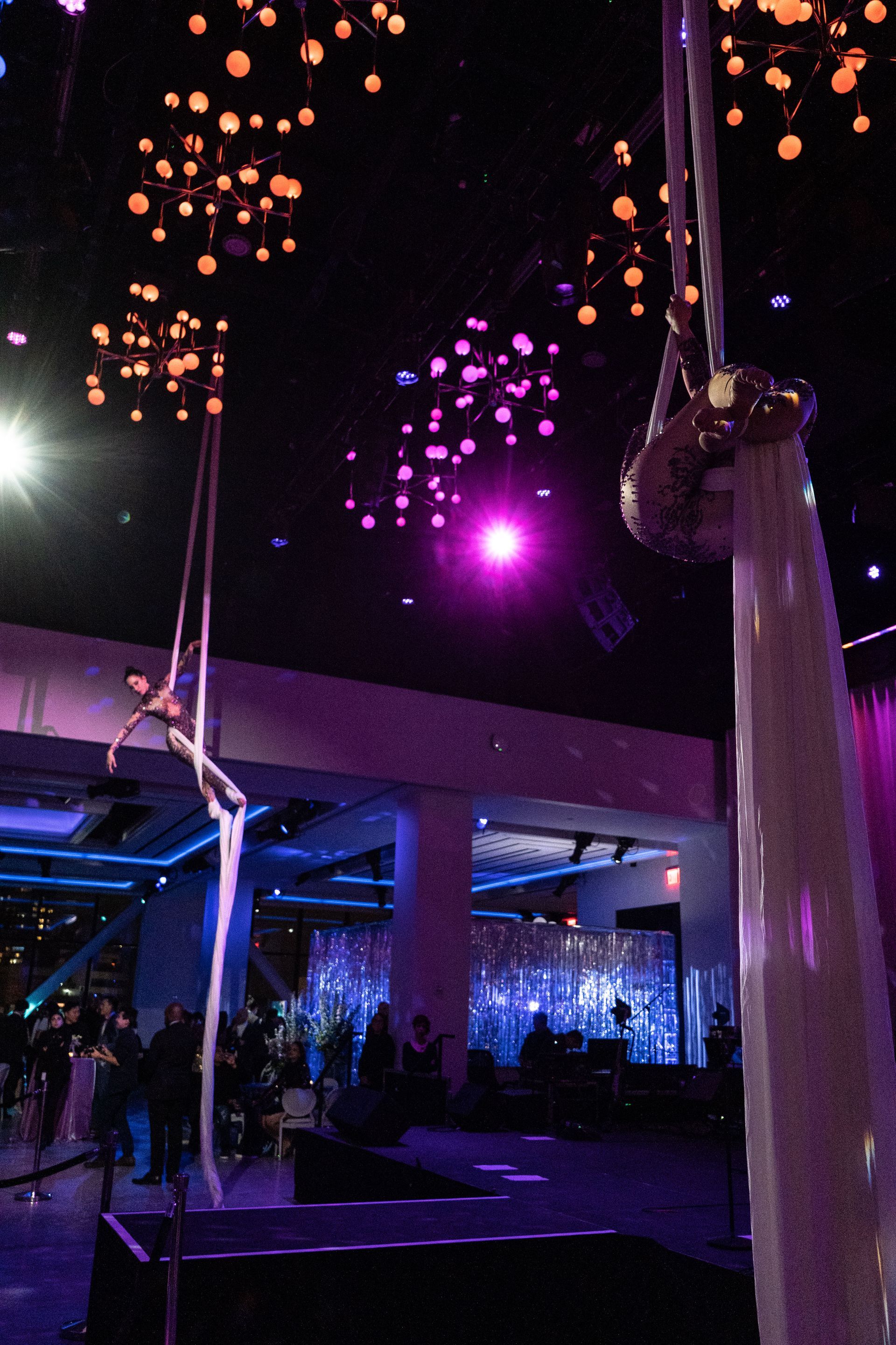 A purple light is hanging from the ceiling of a room