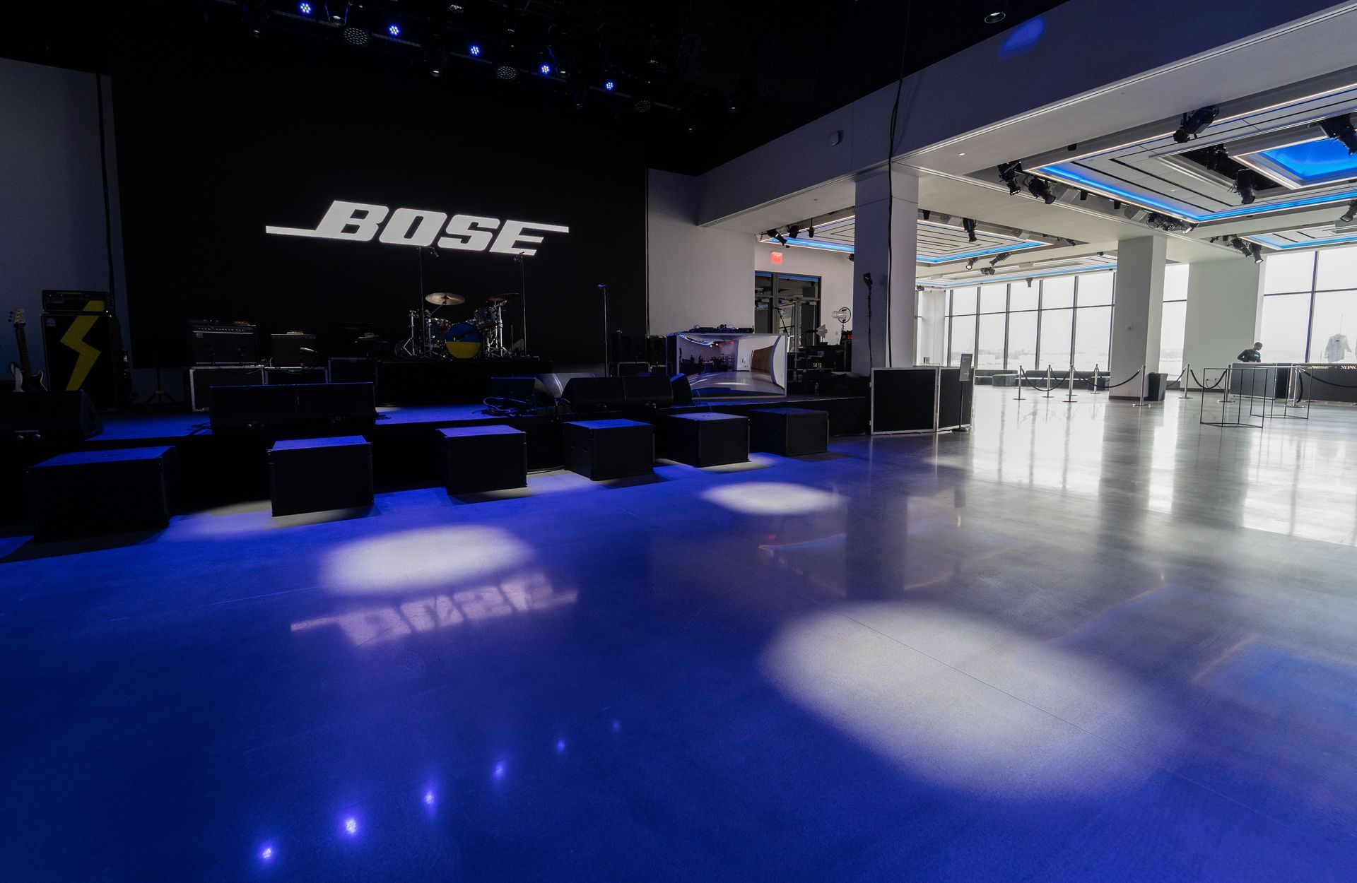 A large room with a bose logo on the wall.