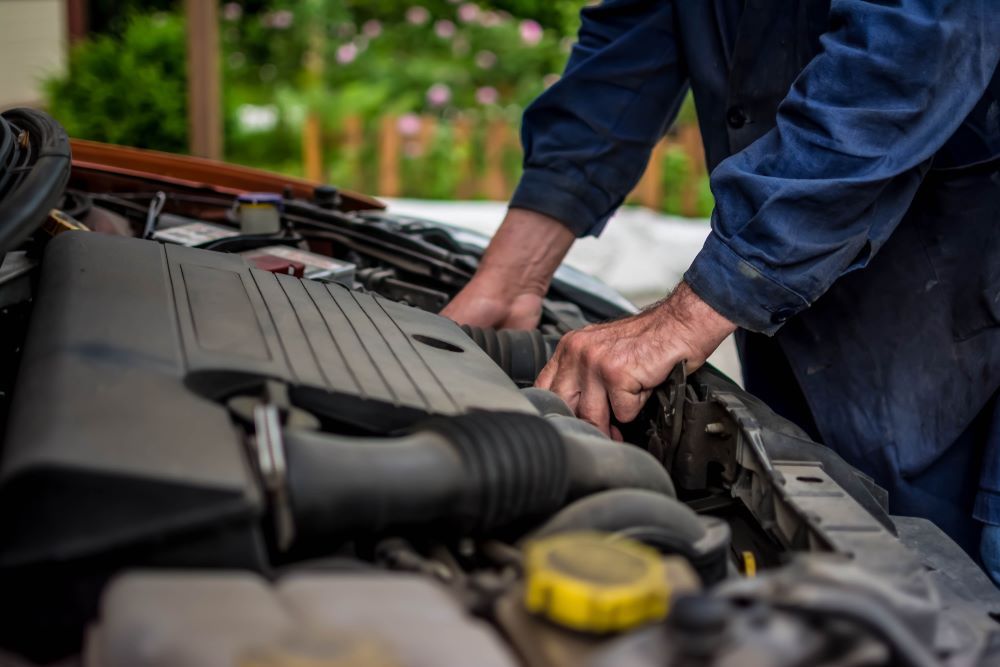 A Man is Working on the Engine — P & R Automotive Services in Pialba, QLD