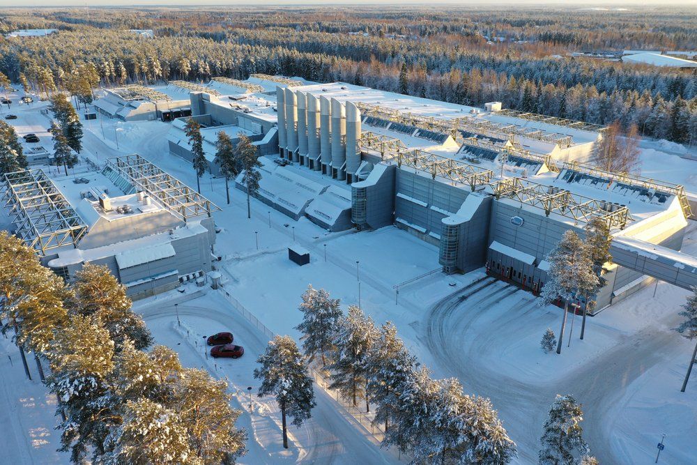 Snow-covered industrial facility highlighting need for large-scale commercial winter maintenance.