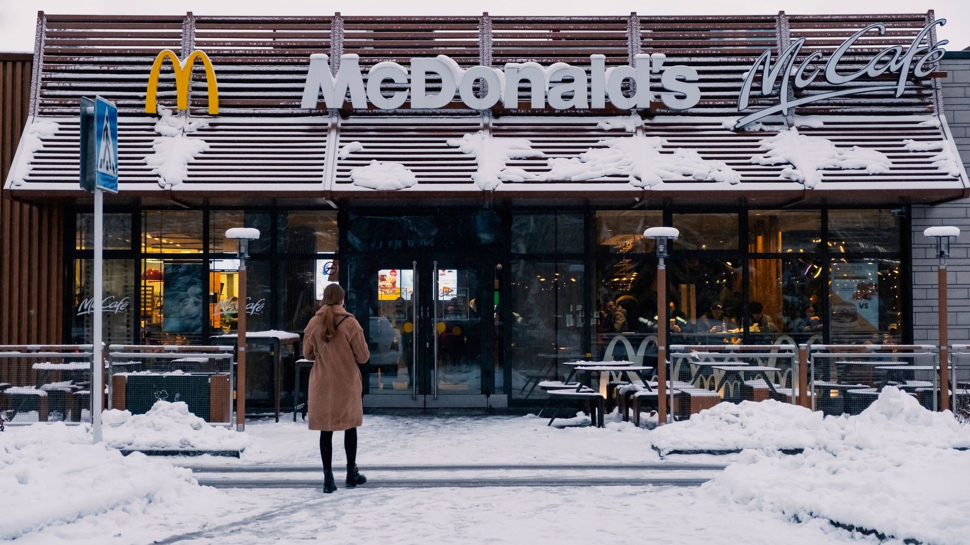 Snow-covered McDonald’s entrance showing winter maintenance needs for commercial properties.