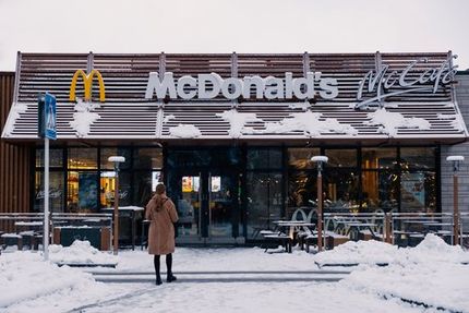 Snow-covered McDonald’s entrance showing winter maintenance needs for commercial properties.