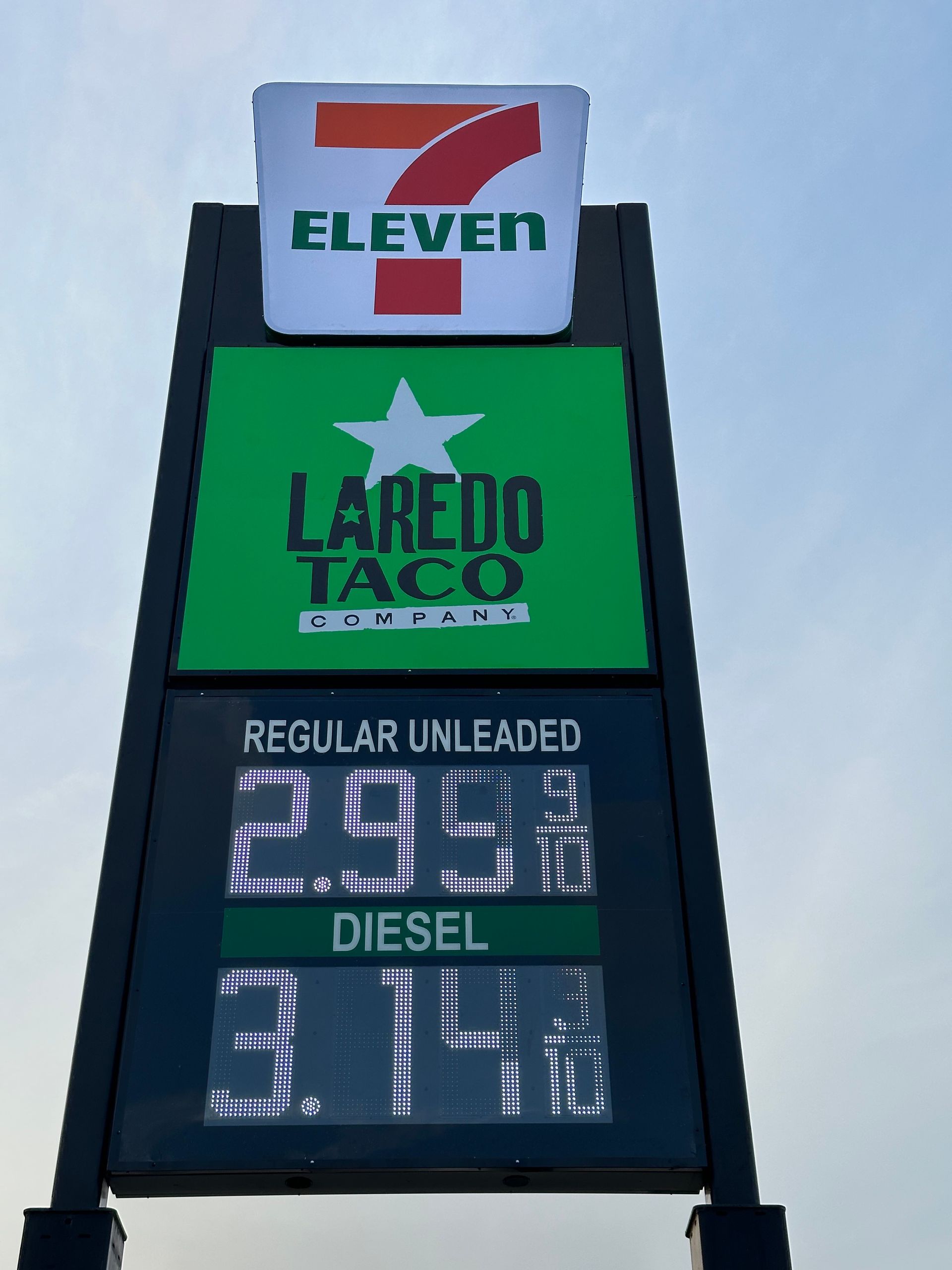 A 7 eleven laredo taco gas station sign