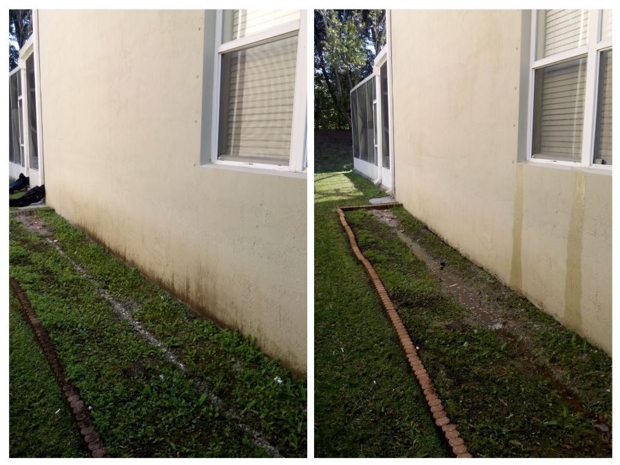 This Is a Picture of a house wall that was soft washed by RNR Pressure Cleaning. You can see a wall with a paverstone garden bed that have been cleaned.
