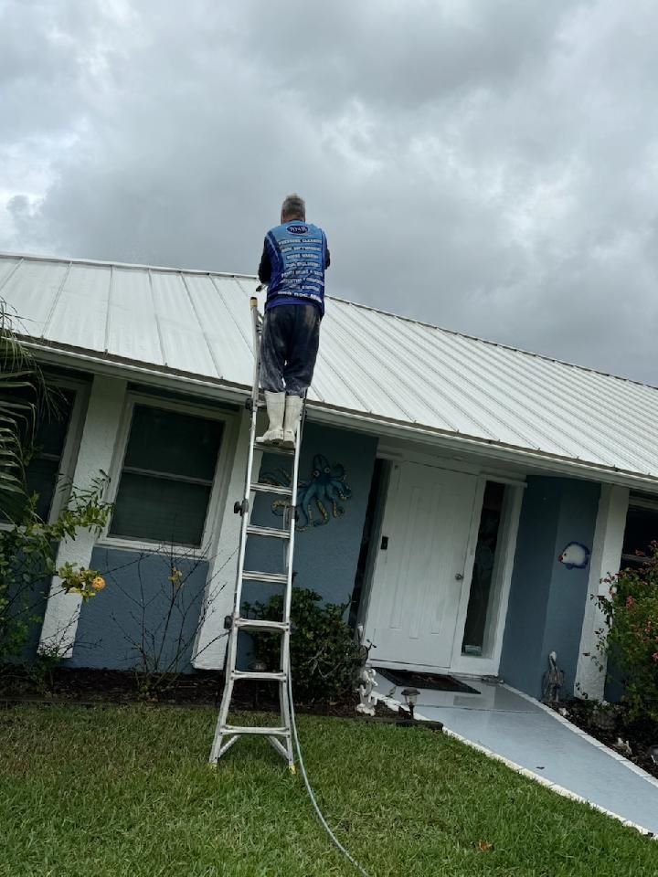 Image of tile roof that is getting black stains removed in Jensen Beach, FL