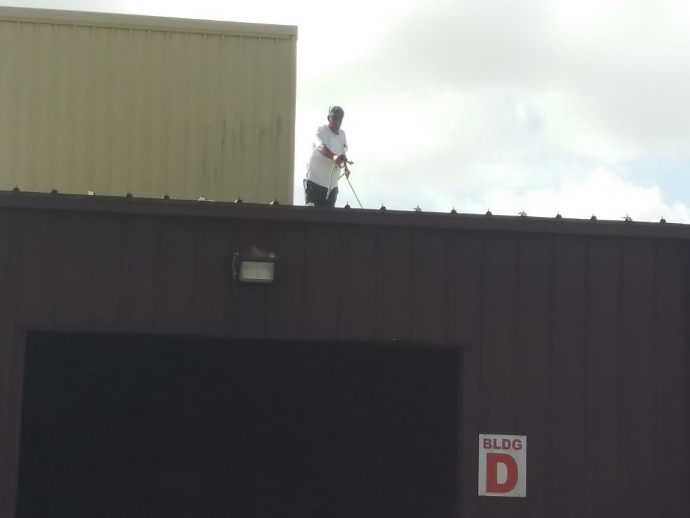 Image of RNR Pressure cleaning performing a commercial roof wash.
