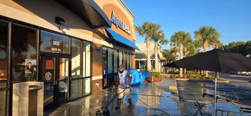 Image showing RNR Pressure pressure washing a sidewalk in a local shopping area in Jensen Beach, FL