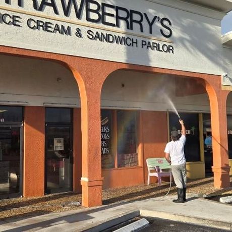 Image showing RNR Pressure Cleaning soft washing cleaning a commercial store.
