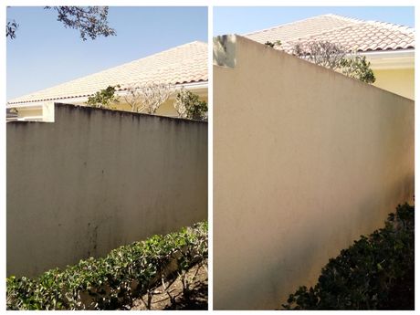 Picture of an exterior wall that was pressure cleaned. You can see the before and after effects of using a gentle soft wash versus high pressure.