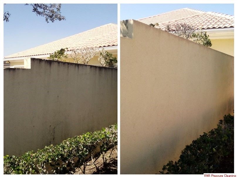 A before and after picture of soft wash done to a exterior wall.
