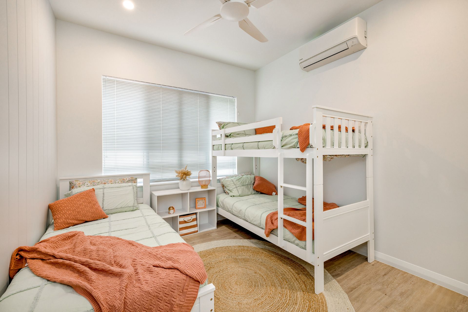 A Bedroom Featuring a White Bunk Bed — Ashlee Jones Homes in Gordonvale, QLD