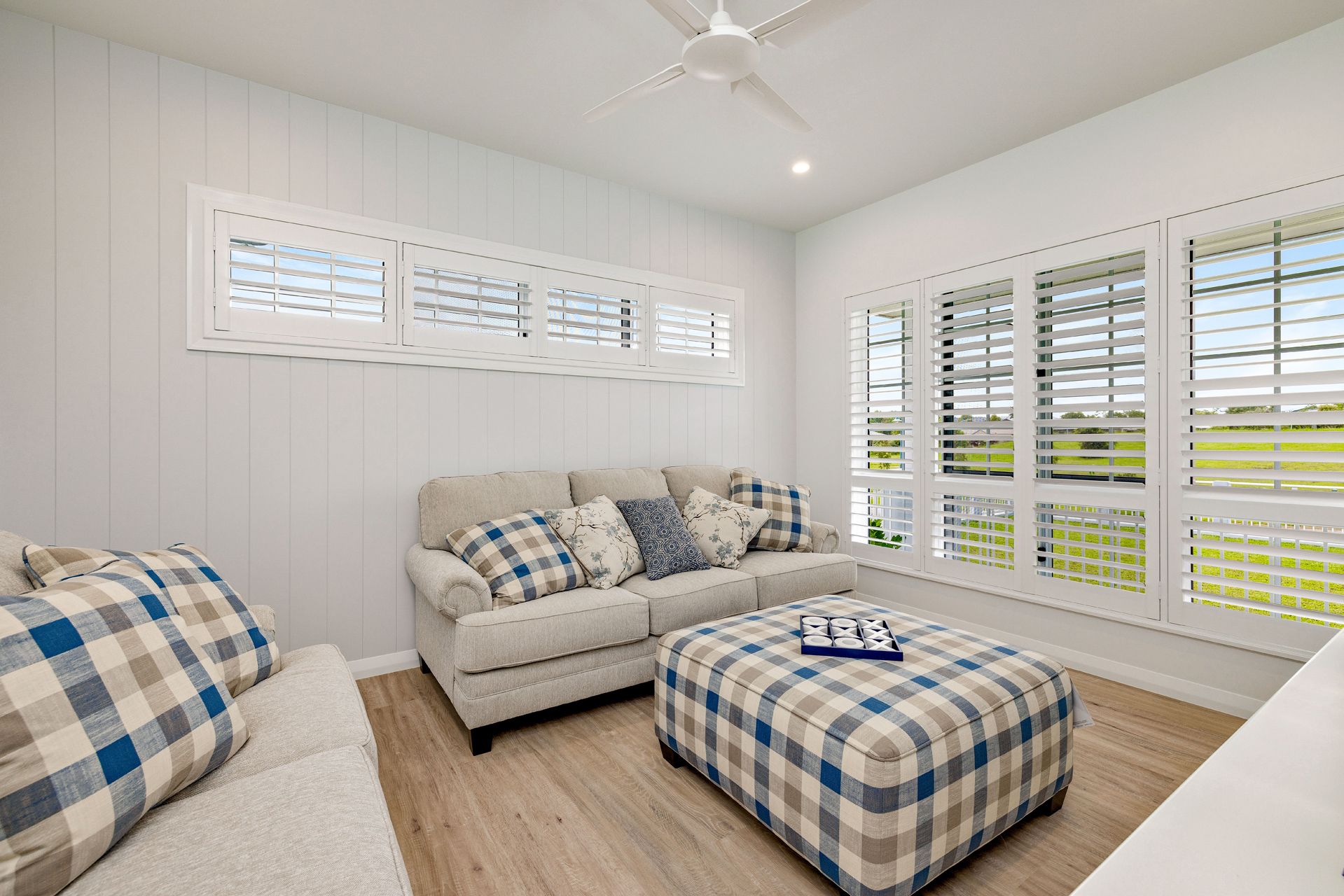 A Living Room With Light Gray Walls — Ashlee Jones Homes in Gordonvale, QLD