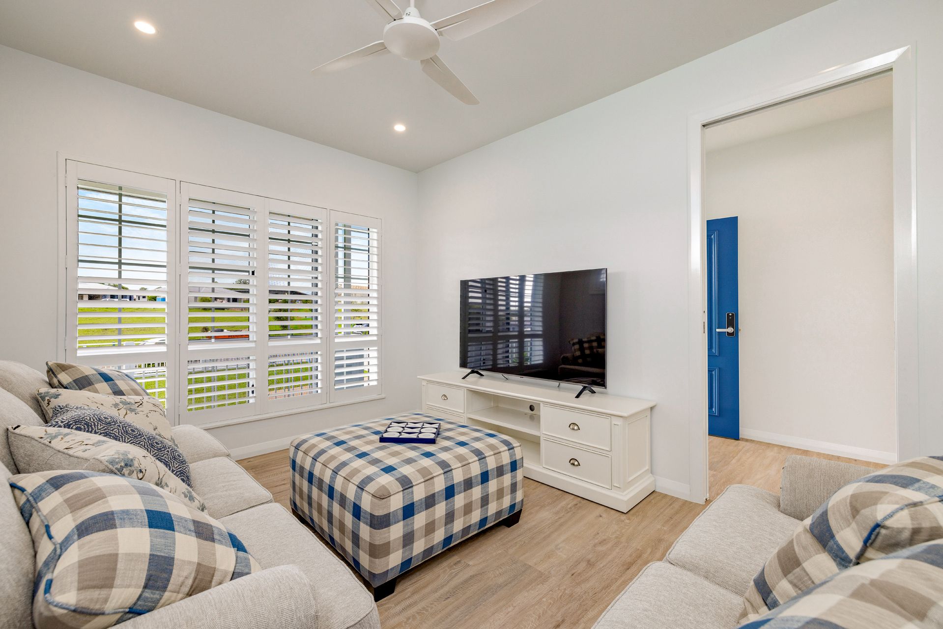 A Modern Living Room With a Neutral Sofa — Ashlee Jones Homes in Gordonvale, QLD