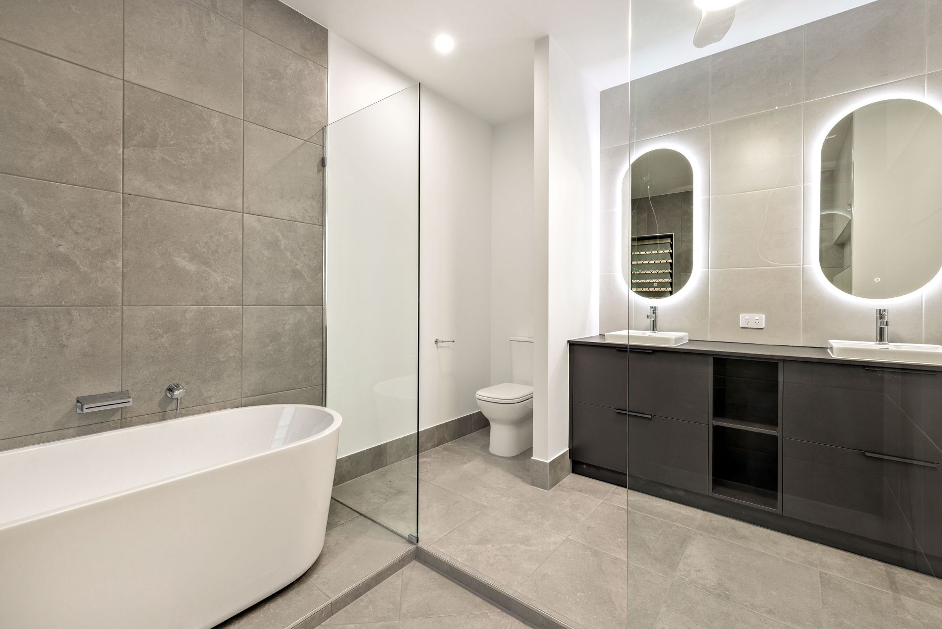 Modern Bathroom With a Freestanding White Tub — Ashlee Jones Homes in Gordonvale, QLD