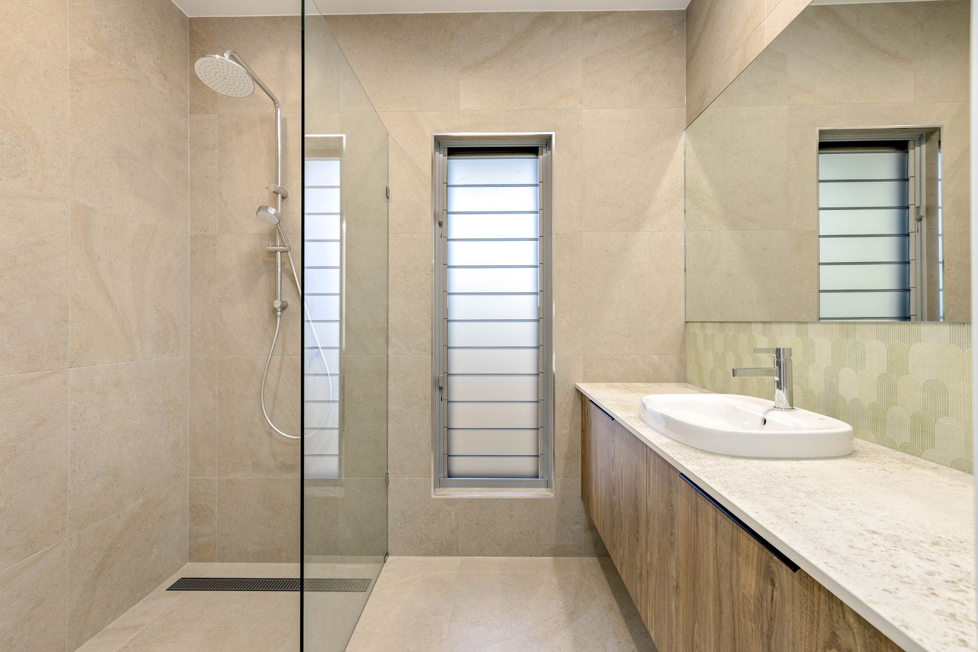 Modern Bathroom With a Glass-enclosed Shower — Ashlee Jones Homes in Gordonvale, QLD