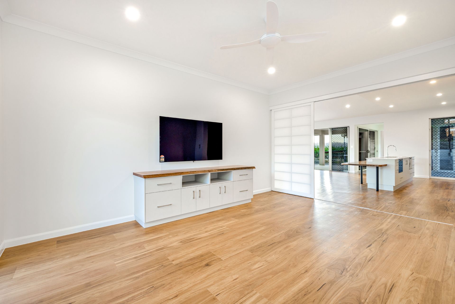 Modern Living Room With a White Media Console — Ashlee Jones Homes in Gordonvale, QLD