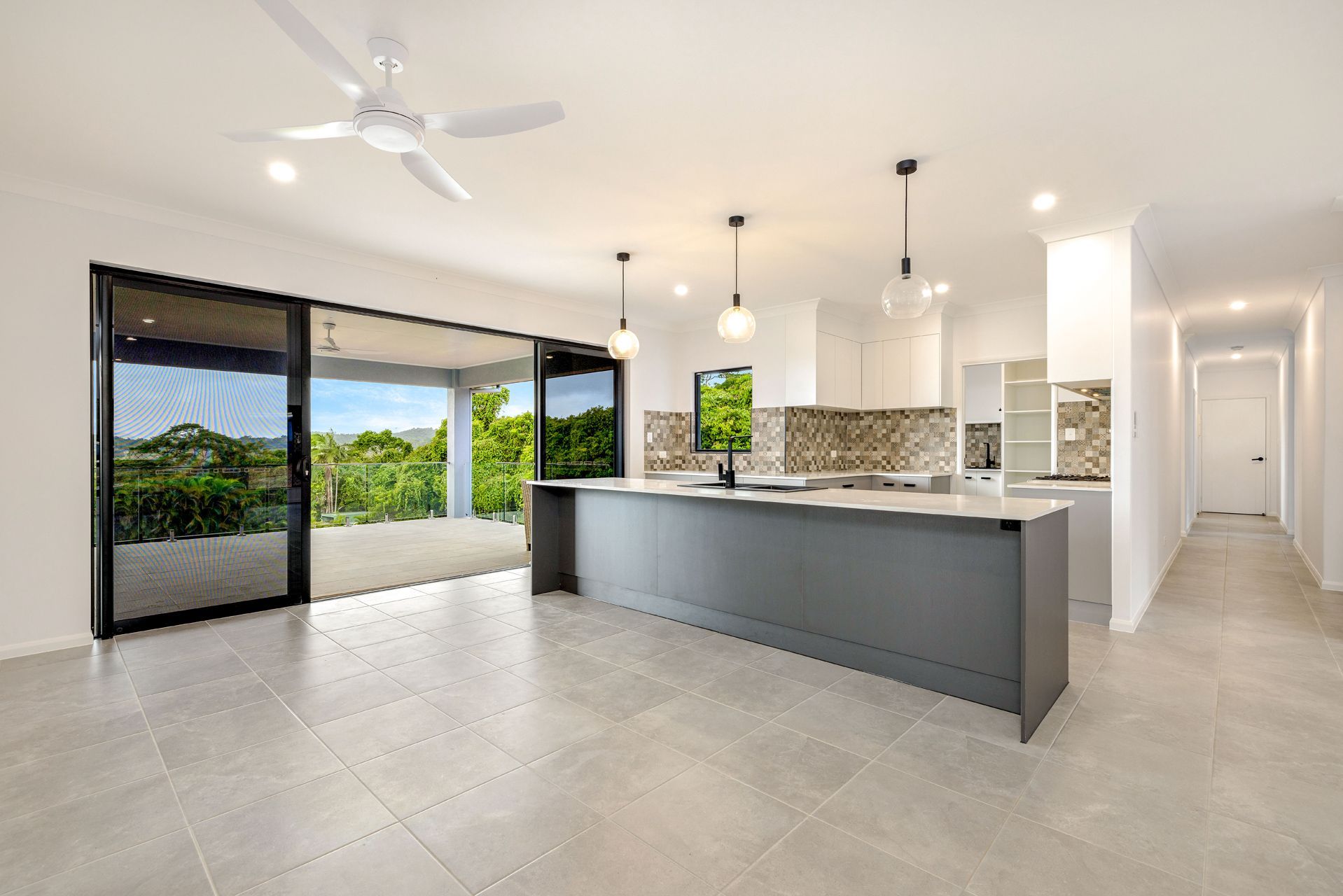 Modern Open-plan Kitchen With a Grey Island — Ashlee Jones Homes in Gordonvale, QLD