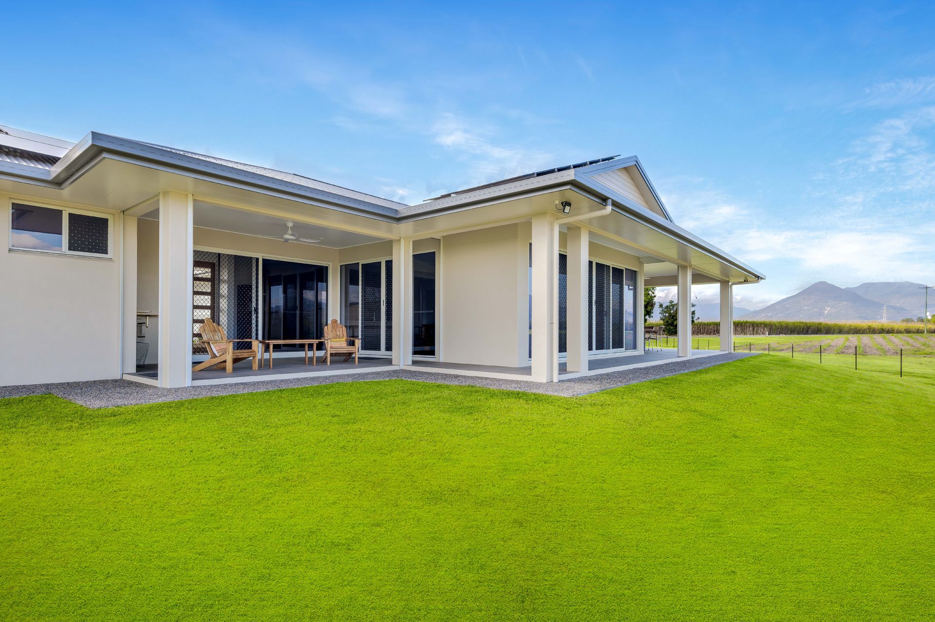 A Light-colored Modern House With a Large Covered Patio — Ashlee Jones Homes in Gordonvale, QLD
