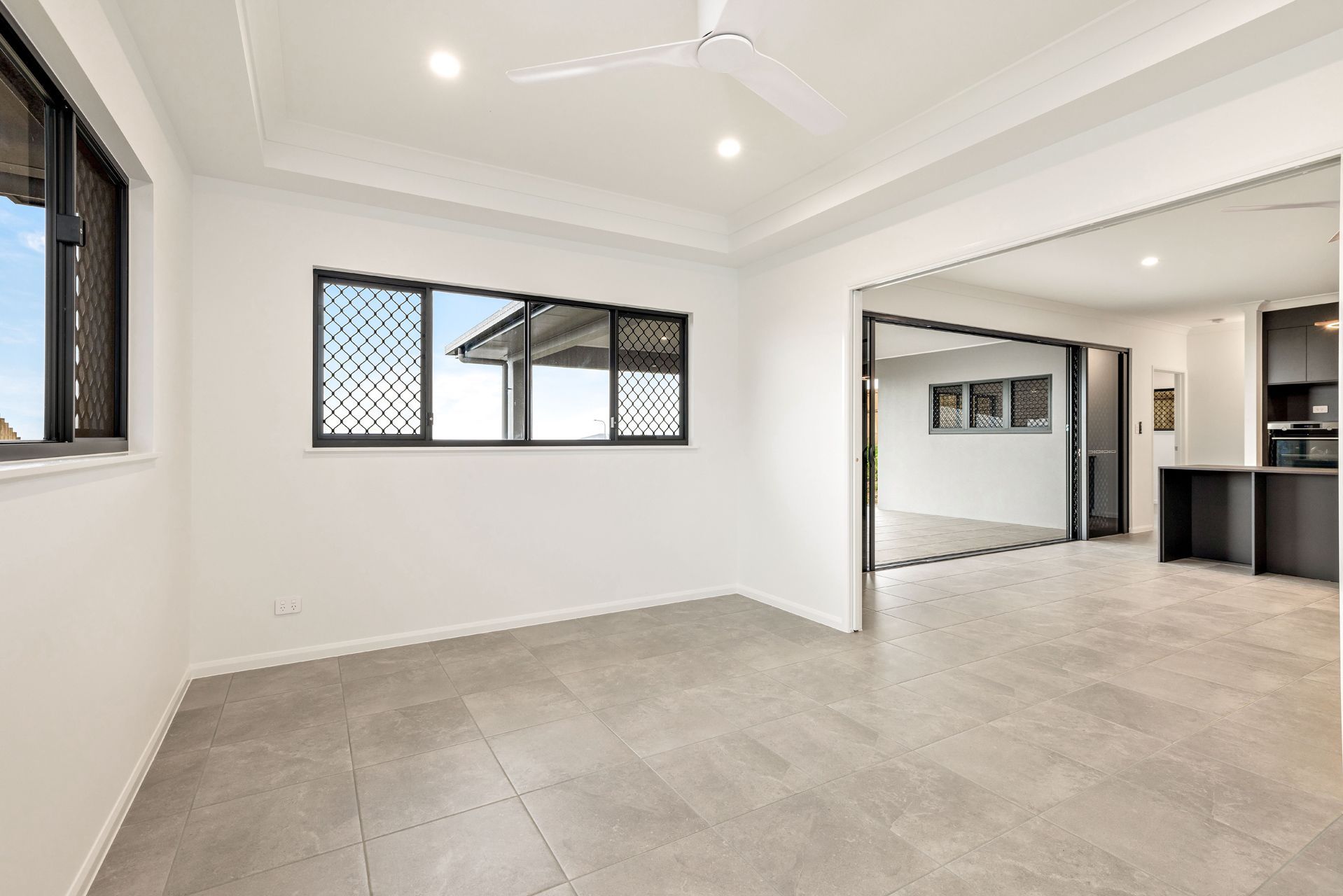 A Bright, Minimalist Room With White Walls — Ashlee Jones Homes in Gordonvale, QLD