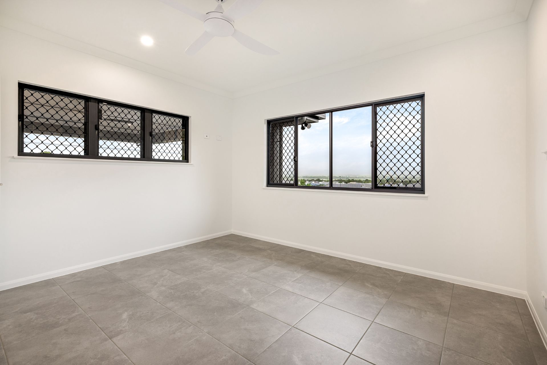 An Empty, Minimalist Room With White Walls — Ashlee Jones Homes in Gordonvale, QLD