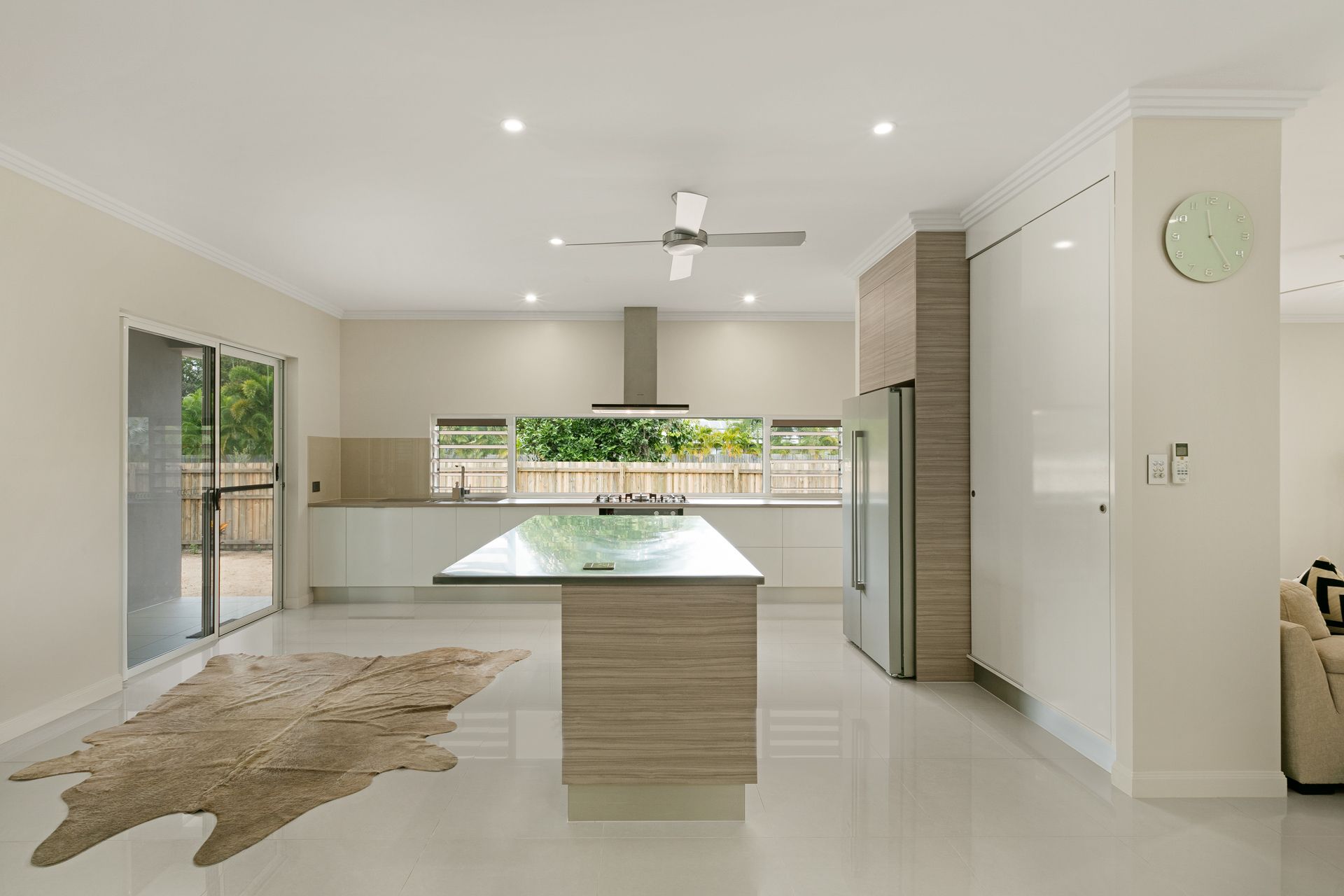 A Modern Kitchen With White Cabinetry — Ashlee Jones Homes in Gordonvale, QLD