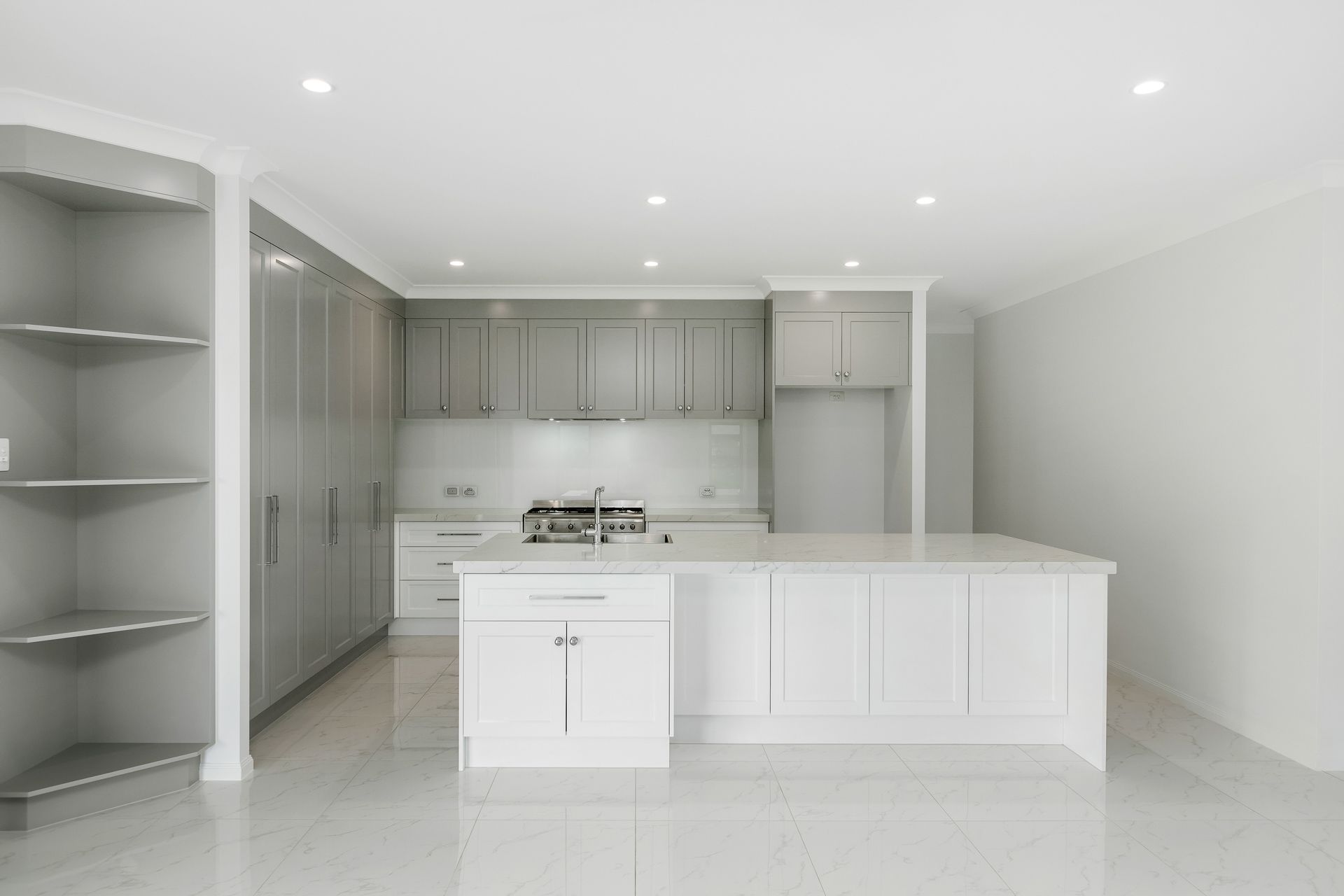 Modern Kitchen With Grey Cabinetry, White Countertops — Ashlee Jones Homes in Gordonvale, QLD