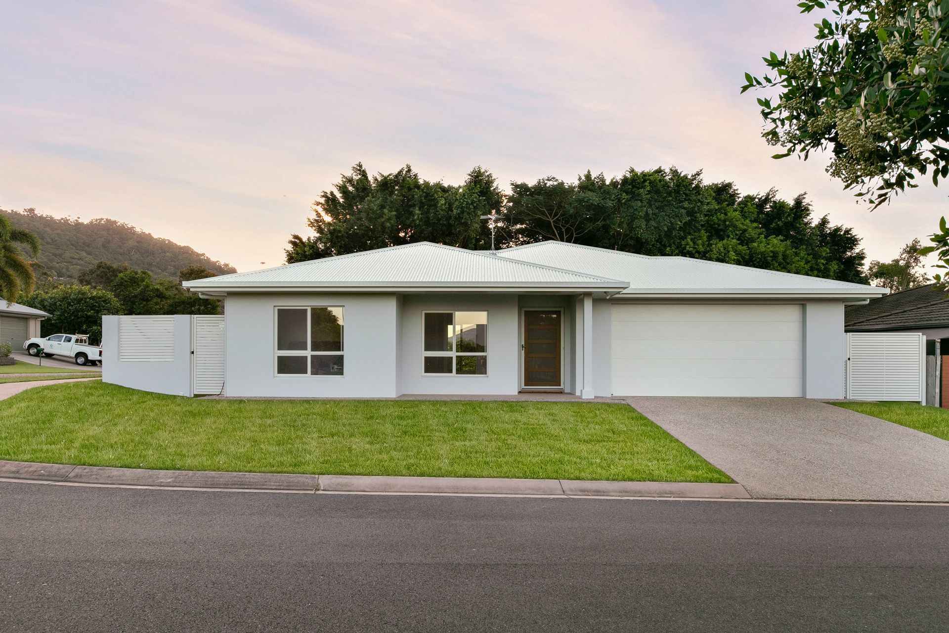 A Modern, Light Gray Single-story Suburban House With a White Roof — Ashlee Jones Homes in Gordonvale, QLD