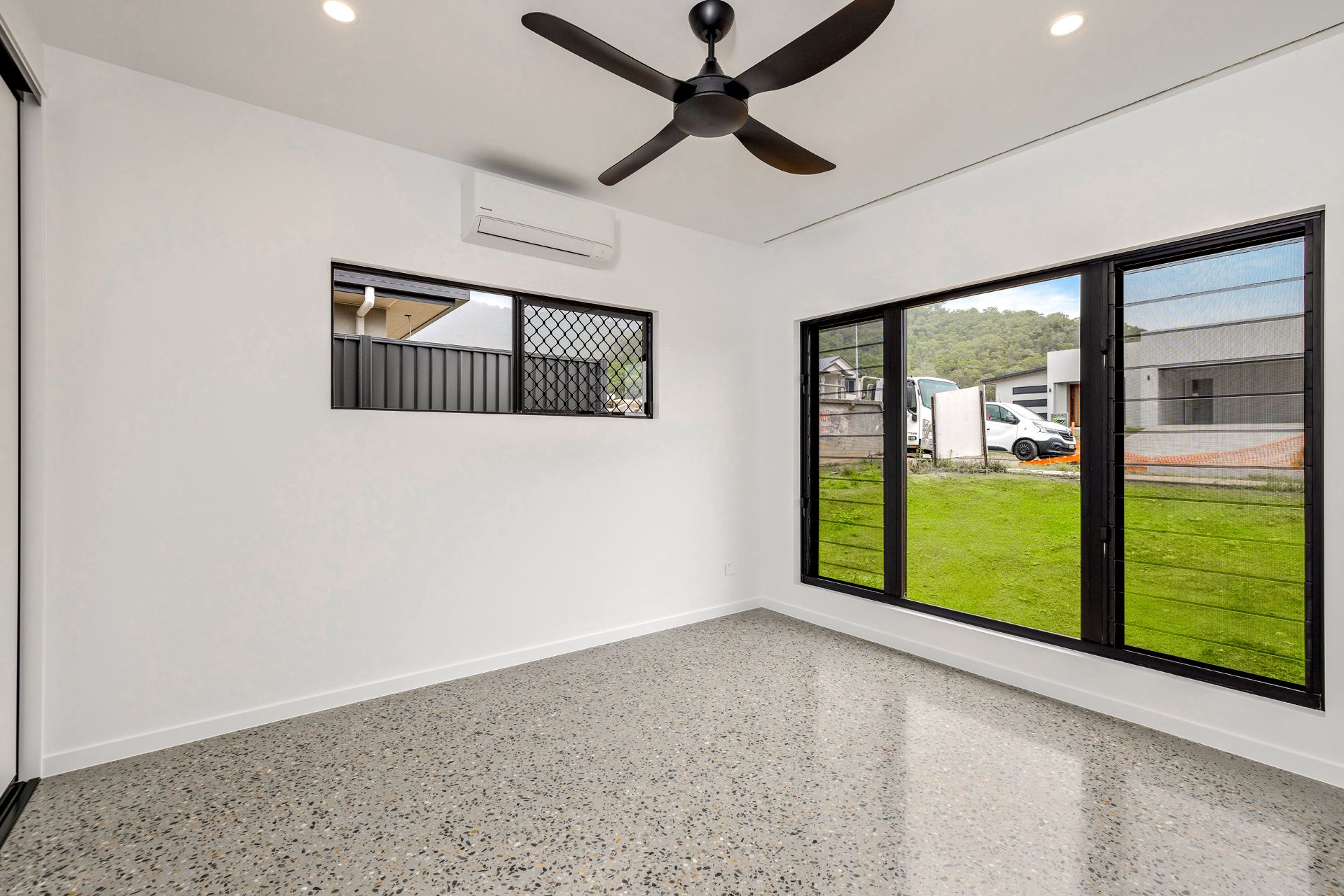 A Minimalist, Modern Room With White Walls — Ashlee Jones Homes in Gordonvale, QLD