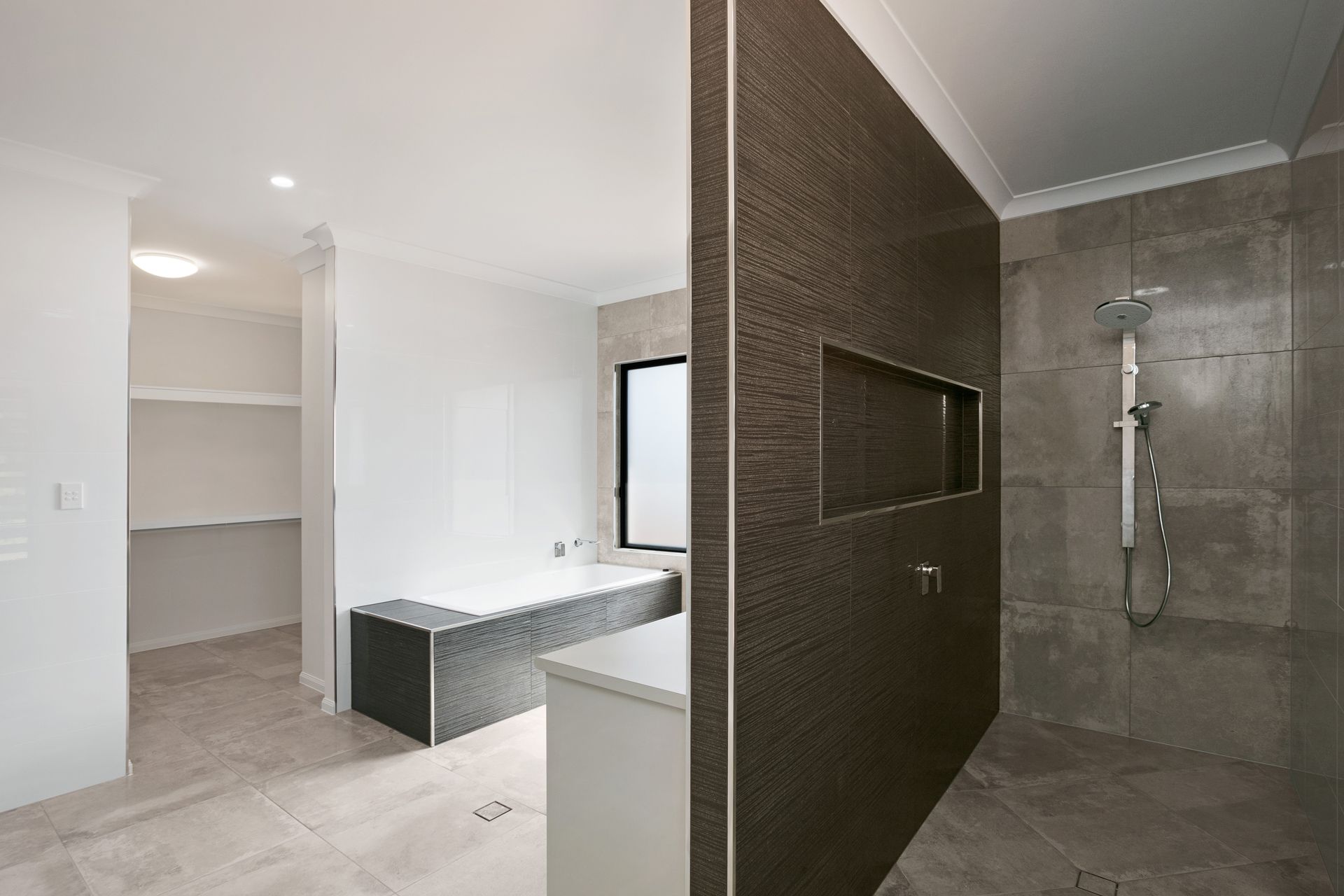 A Modern Bathroom Featuring a Walk-in Shower — Ashlee Jones Homes in Gordonvale, QLD